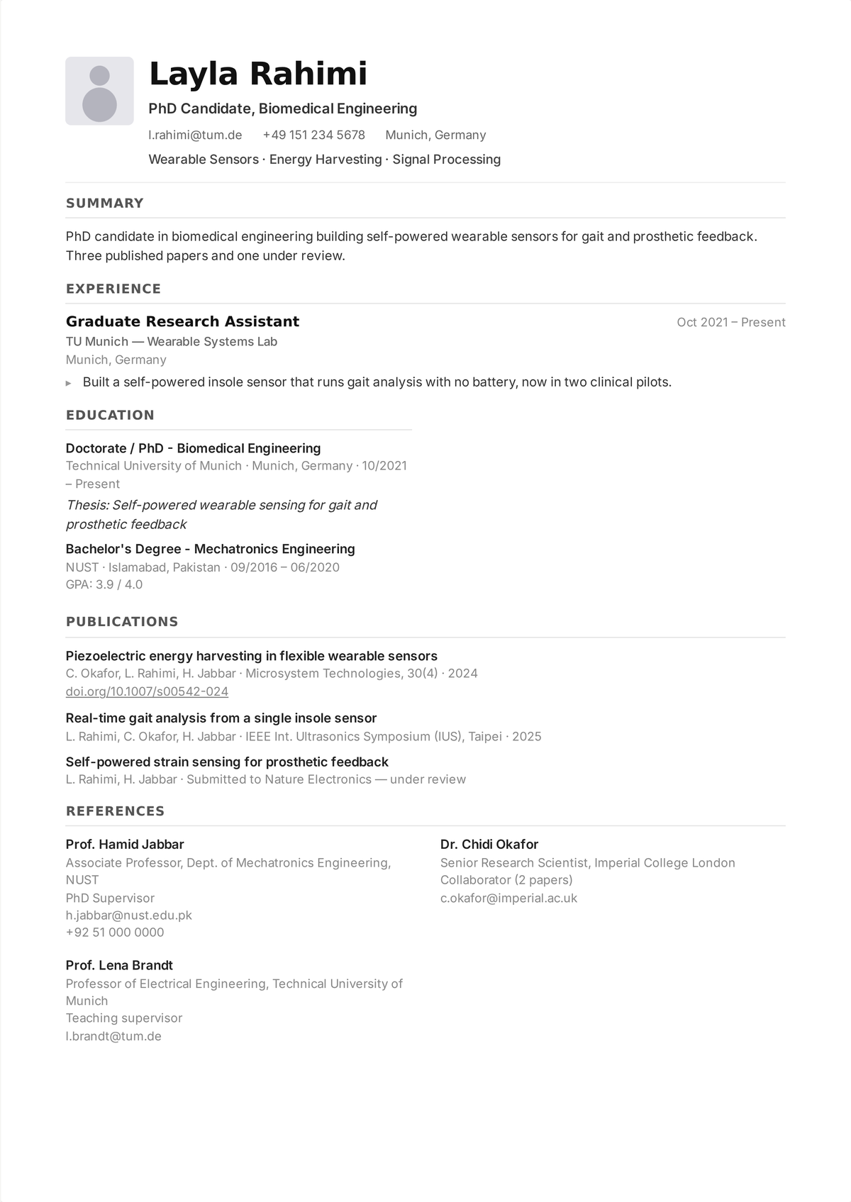 Academic CV example for a PhD candidate, showing a Publications section with journal, conference, and under-review papers and a References section listing three referees with their titles, institutions, and contact details.